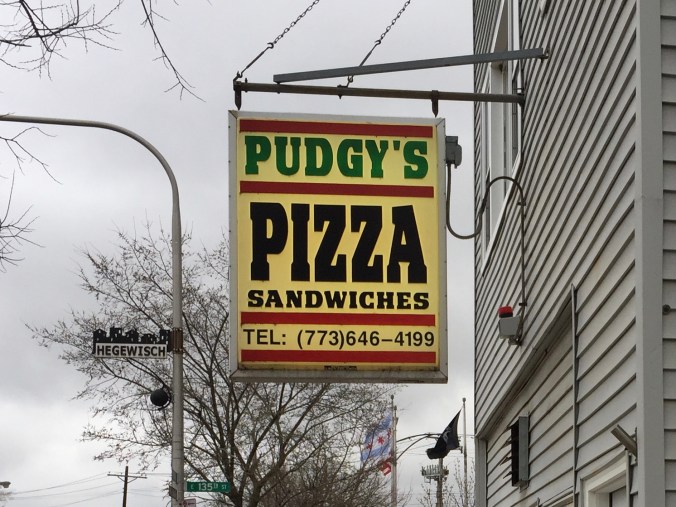 Sign at Pudgy's in Hegewisch with Chicago, American, and POW/MIA Flags