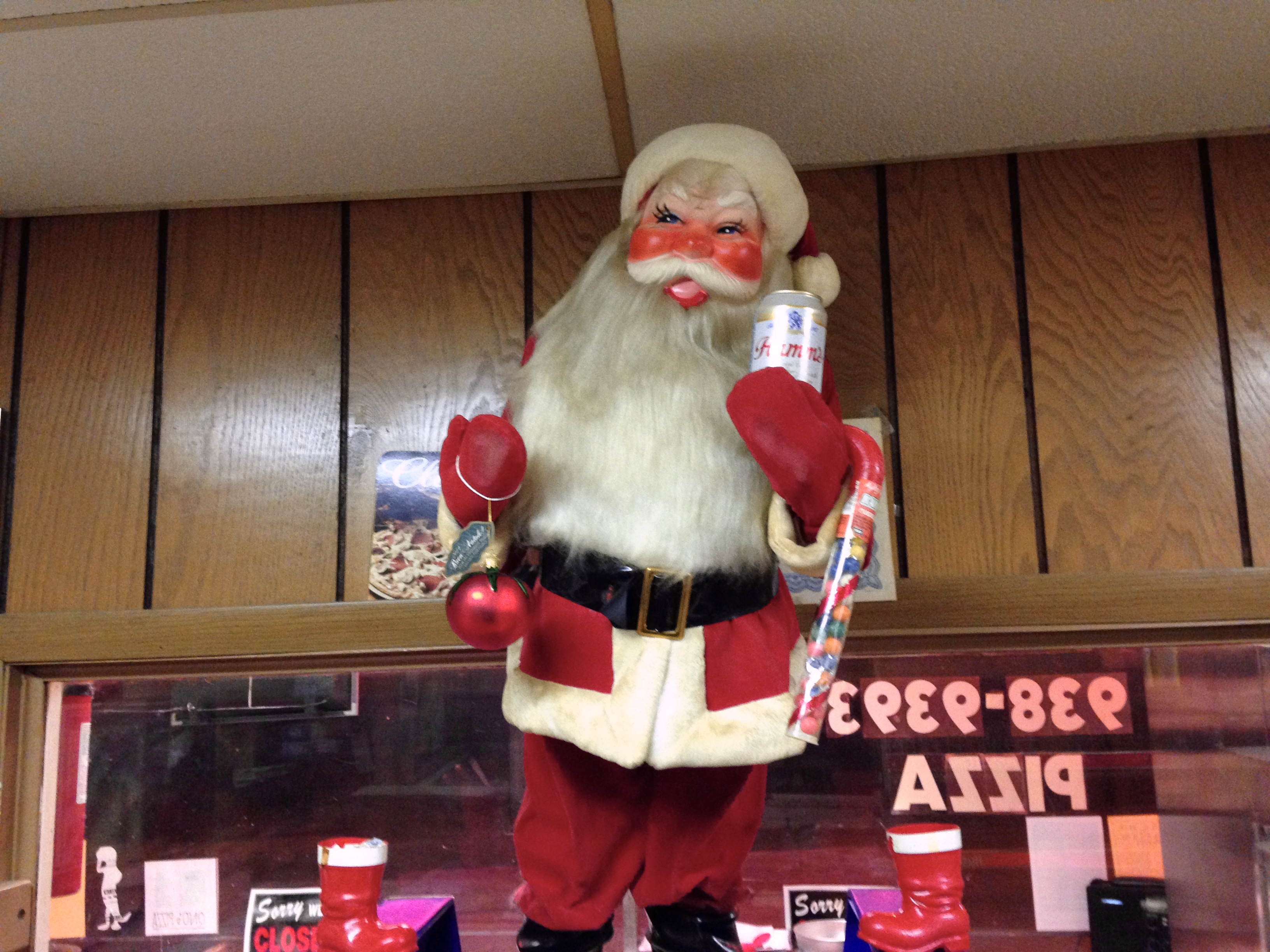 Santa Christmas Display with Hamm's Beer in Front of Wood-Paneling and Window Onto Lake Street at Ono's - December 2014